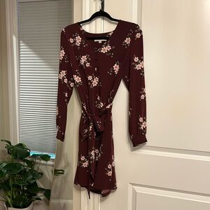 Cute feminine tie waist dress with buttons detail and ruffled cuffs